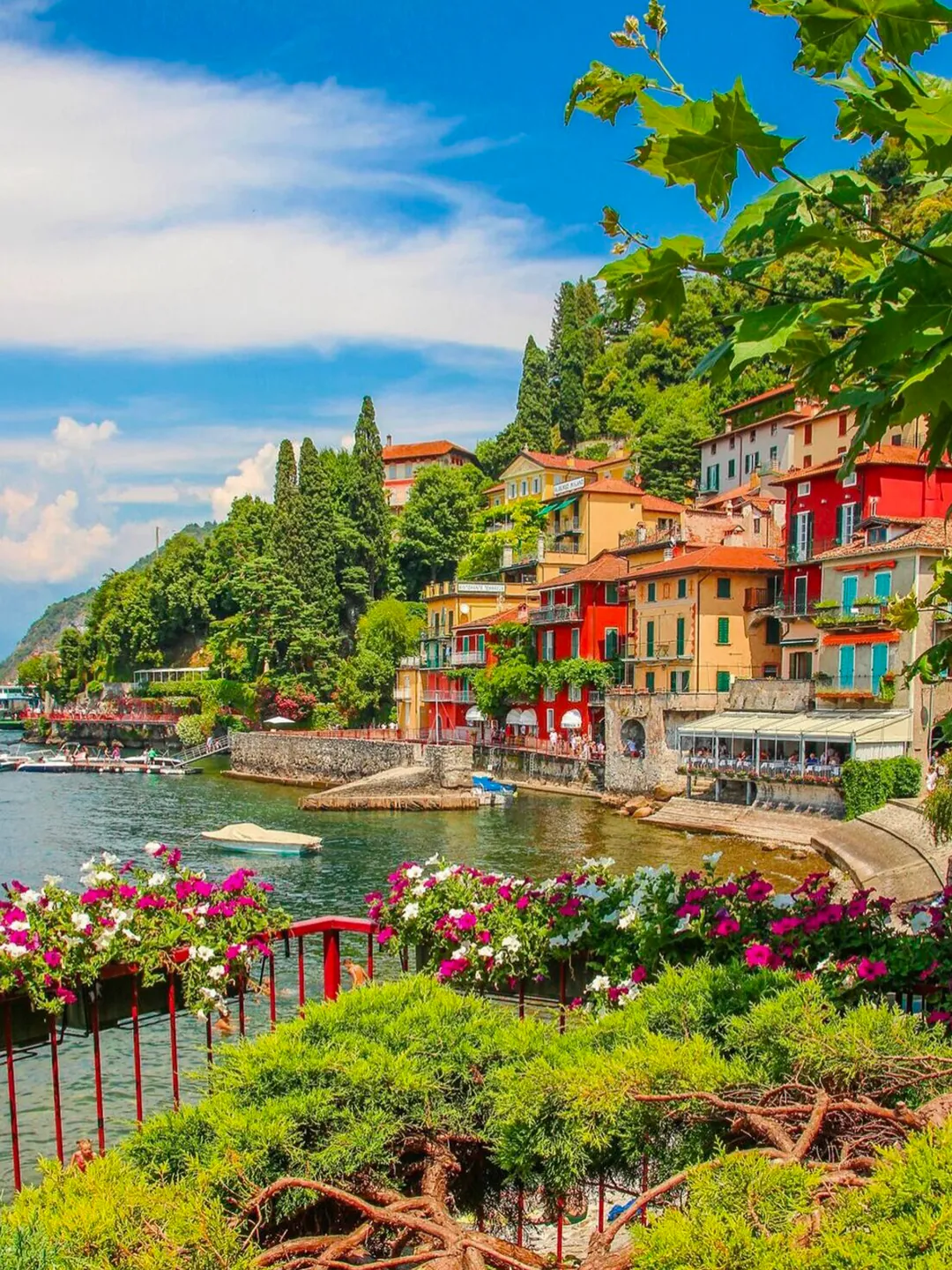 Colourful waterfront houses and flower terraces in Varenna on Lake Como