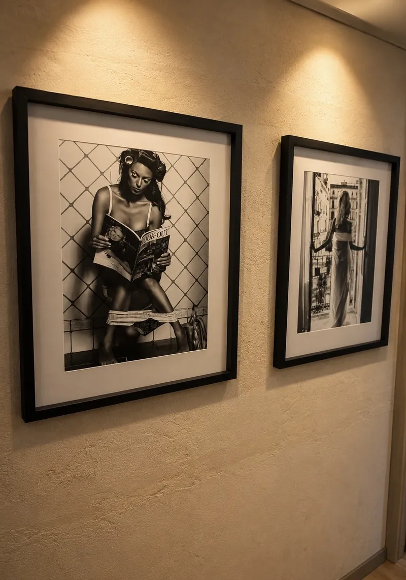 Framed vintage-style portraits further along the hallway