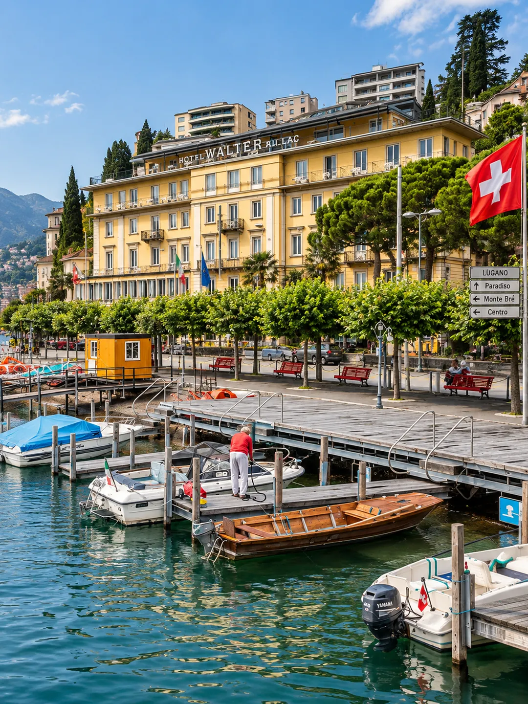 Hotel Walter au Lac on the Lugano waterfront, with boats moored along the lake